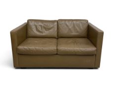 A vintage two seater sofa of compact size in leather upholstery. H 75cm x W 134cm x D 81cm