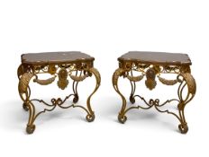 A pair of contemporary Italian side or lamp tables with swag and shell decorated gilt metal frame.