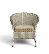 A vintage LLoyd Loom style tub armchair with drop in upholstered seat. H.73 x W.64 x D.62cm