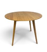 A 1960's retro styled light oak dining table on splay supports. H.76 x W.100 x D.100cm