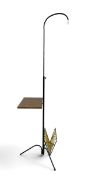 A vintage floor standing reading lamp with adjustable height mechanism and fitted with tray table
