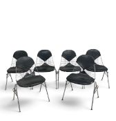 A set of six Eames style DKR bikini chairs in black upholstery. H 60cm x W 85cm x D 50cm