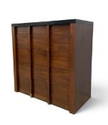 A contemporary teak chest of drawers, mid-century geometric design with stone top and sculptural