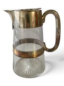 An early 20th century lemonade jug, silver plate mounted to spout and handle with cut glass base.