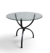 A contemporary side table, circular glass top with pewter effect base in hourglass form. H.76 x Dia.