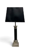 A contemporary table lamp, Doric column form with a silvered base and pediment with rectangular