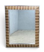 A large contemporary wall mirror with faux snakeskin decoration in a chrome outer frame. H.152 x W.