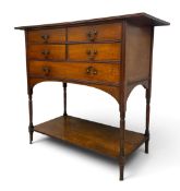 A late 19th century walnut Arts and Crafts console table side cabinet with drop handles and turned