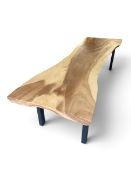 A contemporary dining table from a single cut of Indonesian suar on metal frame. H.74 x L.300 x