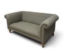 A contemporary Chesterfield style upholstered two seater sofa, rolled piped arms with a fixed seat