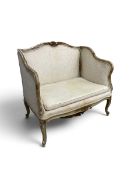 A contemporary Louis XV style two seater canape sofa, carved wooden frame with upholstered seat