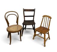 A collection of three children's chairs to include one bentwood and a 19th century elm seated
