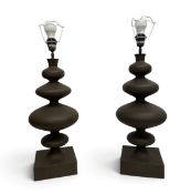 A pair of contemporary Parex table lamps, sculptured form with a heavy plinth and shades and label
