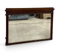 An early 20th century mahogany wall or overmantel mirror, in the Adam style with a fluted and floral