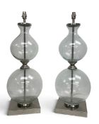 A pair of contemporary table lamps, clear double gourd form base. H.70cm
