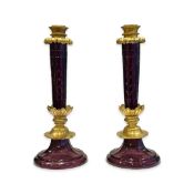 A PAIR OF 19TH / 20TH CENTURY RUSSIAN AMETHYST GLASS AND ORMOLU CANDLESTICKS