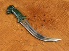 AN INDIAN MUGHAL JADE AND STEEL KHANJAR DAGGER IN THE FORM OF A RAM'S HEAD