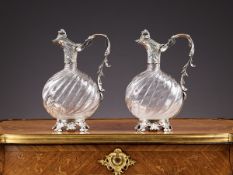 A FINE PAIR OF LATE 19TH CENTURY FRENCH SILVER AND GLASS CLARET JUGS