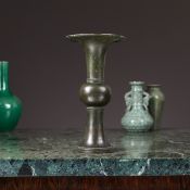 A CHINESE BRONZE TRUMPET VASE