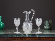 A MID 19TH CENTURY ENGRAVED GLASS WATER PITCHER AND TWO GLASSES