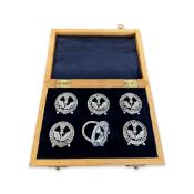 A SET OF SIX STERLING SILVER MENU HOLDERS RELATING TO THE SCOTS GUARDS, C. 1892