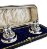 A PAIR OF EDWARDIAN STERLING SILVER DOUBLE OWL MENU HOLDERS IN BOX