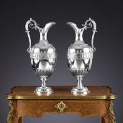 ELKINGTON & CO.: A MASSIVE PAIR OF STERLING SILVER EWERS, C. 1875