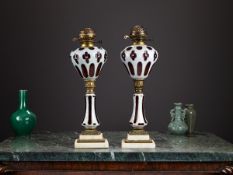 A PAIR OF LATE 19TH / EARLY 20TH CENTURY BOHEMIAN GLASS OIL LAMPS