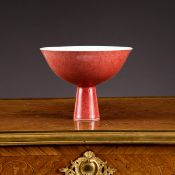 A CHINESE QING PERIOD RED GLAZED PORCELAIN STEM BOWL