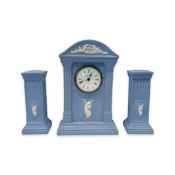 A WEDGWOOD JASPER WARE CLOCK GARNITURE