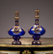 A MATCHED PAIR OF ISLAMIC STYLE BLUE AND GILT GLASS VASES