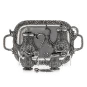 A 20TH CENTURY THAI SOLID SILVER FOUR PIECE TEA SET ON TRAY C. 1950