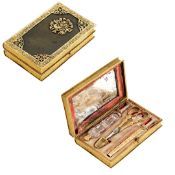 A FINE AND RARE EARLY 19TH CENTURY PALAIS ROYAL GOLD AND ORMOLU BOOK NECESSAIRE