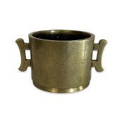 A 19TH CENTURY CHINESE BRONZE TWIN HANDLED CENSER