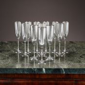 A SET OF TWELVE STERLING SILVER CHAMPAGNE FLUTES