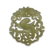 A CHINESE CARVED JADE RELIEF OF A PARROT