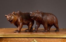 A PAIR OF 19TH CENTURY BLACK FOREST CARVED LINDENWOOD MODELS OF BEARS