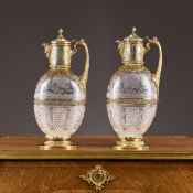 A FINE PAIR OF 19TH CENTURY SILVER GILT AND STOURBRIDGE CRYSTAL CLARET JUGS, CHARLES EDWARDS