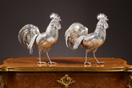 A RARE PAIR OF EARLY 20TH CENTURY STERLING SILVER COCKERELS WITH IMPORT MARKS