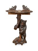 A 19TH CENTURY SWISS BLACK FOREST CARVED WOOD TABLE MODELLED WITH BEARS