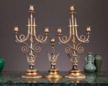 A SET OF THREE CANDELABRA DEPICTING EAGLES WRESTLING SNAKES