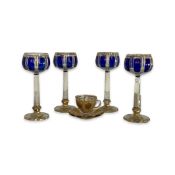 A SET OF FOUR BOHEMIAN CLEAR AND FLASHED BLUE GLASS GOBLETS AND A CUP AND SAUCER