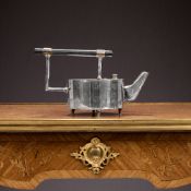 A SILVER PLATED TEAPOT AFTER THE DESIGN BY CHRISTOPHER DRESSER