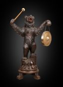 A LARGE 19TH CENTURY BLACK FOREST CARVED BEAR GONG