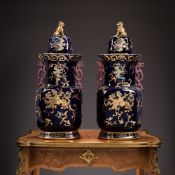 A LARGE PAIR OF CHINESE STYLE VASES AND COVERS