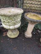 A concrete garden planter and pedestal with a birdbath