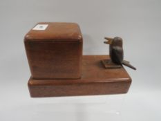 A novelty treen pecking bird cigarette dispenser