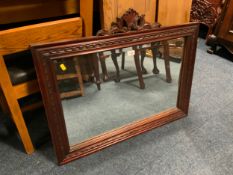A carved mahogany wall mirror W 86 cm
