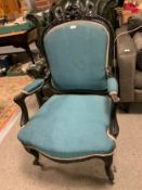 An antique ebonised chair