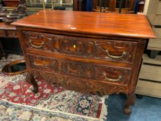 A carved mahogany two drawer shaped chest W 120 cm